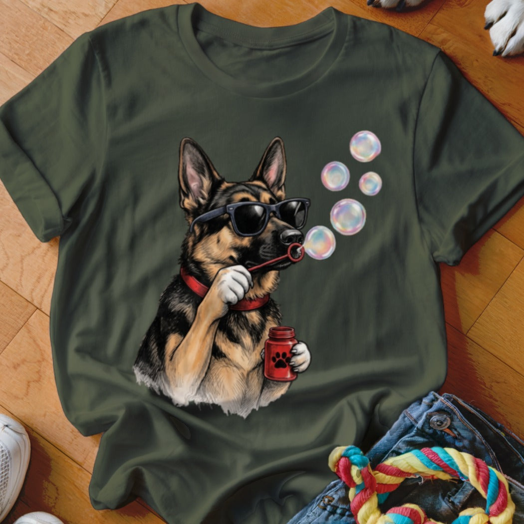 Olive green t-shirt featuring a graphic of a German Shepherd wearing sunglasses and blowing soap bubbles.