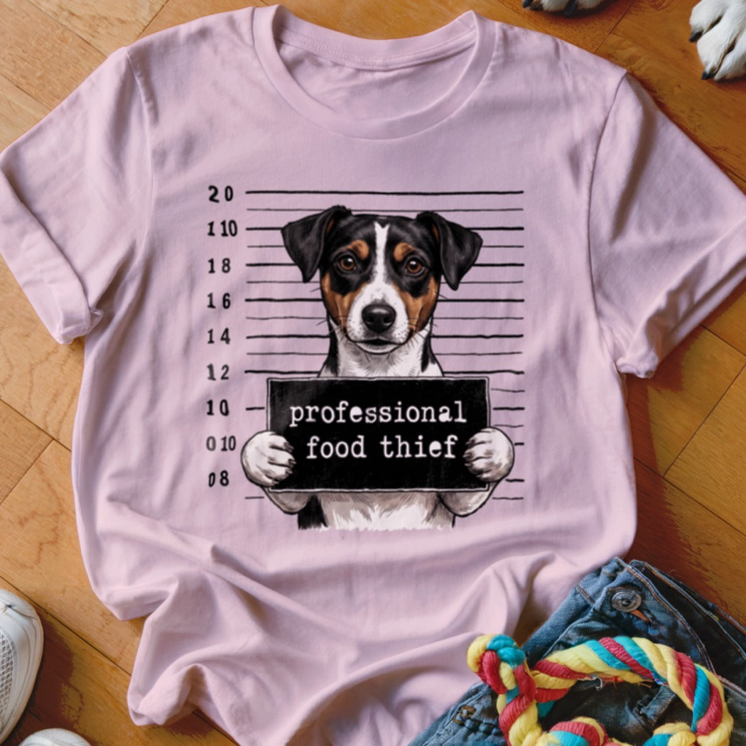 Pink t-shirt with a dog mugshot graphic that reads "professional food thief."