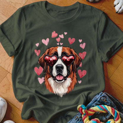 Dark green t-shirt featuring a Saint Bernard wearing heart-shaped sunglasses, surrounded by pink hearts.