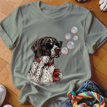 Gray short-sleeved t-shirt featuring a graphic of a spotted dog wearing sunglasses and blowing bubbles.