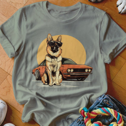 German Shepherd wearing sunglasses sitting next to a vintage car