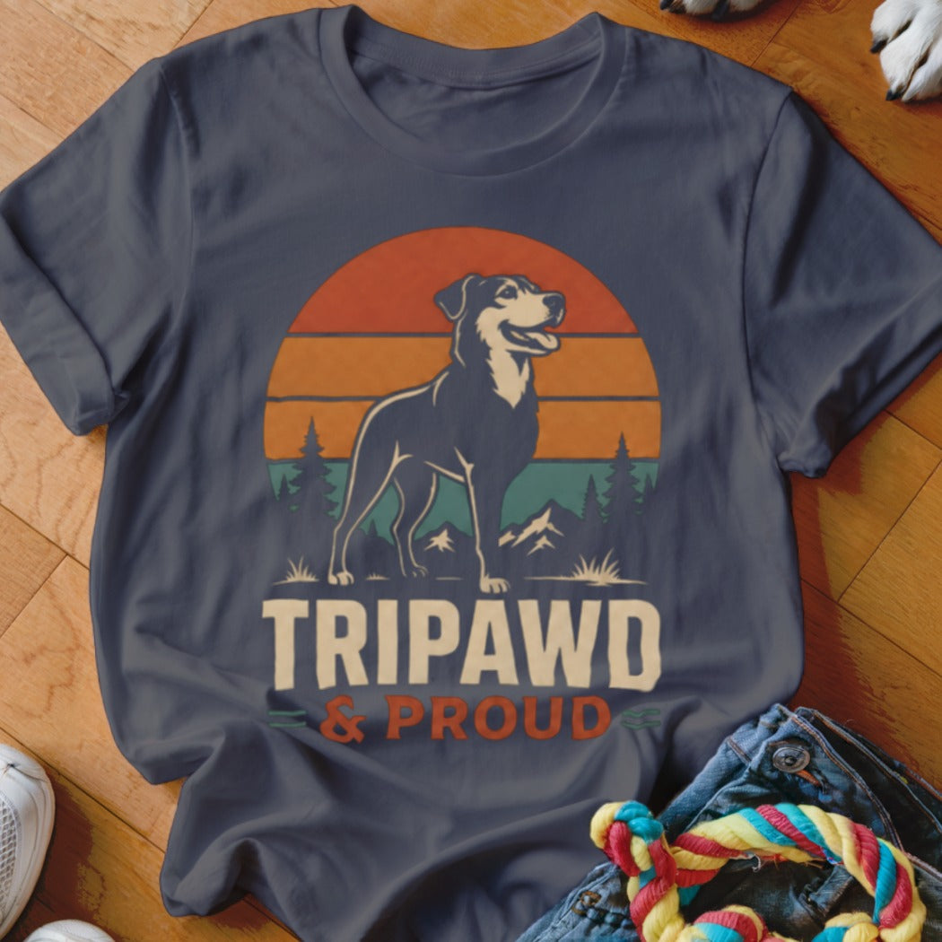 Dark blue t-shirt with a dog in front of a sunset and mountains, reading "TRIPAWD & PROUD".