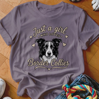 A purple t-shirt featuring a Border Collie graphic with the text Just a girl who loves Border Collies.