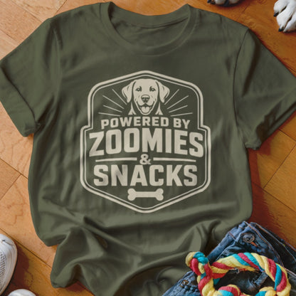 Olive green t-shirt with "Powered by Zoomies & Snacks" graphic featuring a dog.
