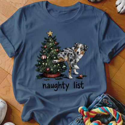 Blue t-shirt with a Christmas tree and a dog lifting its leg, text reads "naughty list".