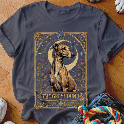 A dark gray t-shirt featuring a tarot card graphic of a greyhound dog with thistles and a crescent moon.