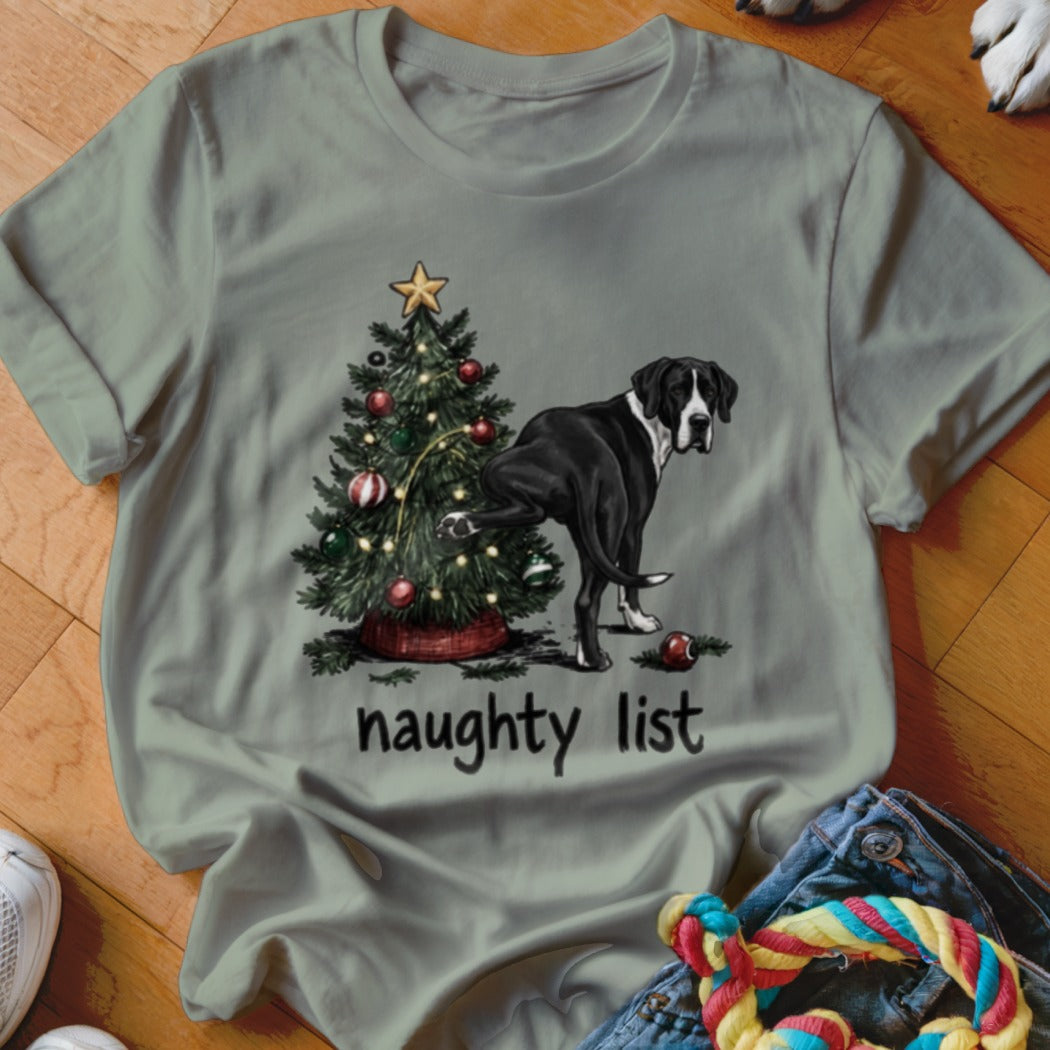 Great Dane by Christmas tree with "naughty list" text.