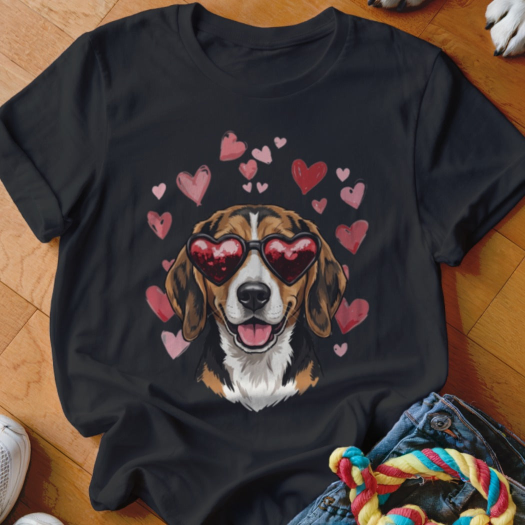 A black t-shirt printed with a beagle wearing heart-shaped sunglasses surrounded by pink hearts.