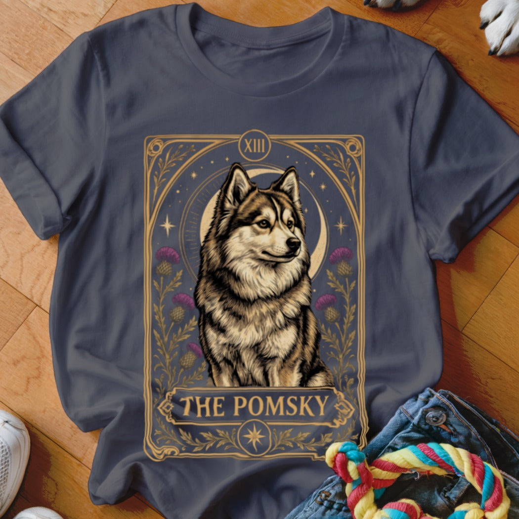 Dark gray t-shirt featuring a tarot-style graphic of a fluffy pomsky dog, moon, thistles, and the text The Pomsky.