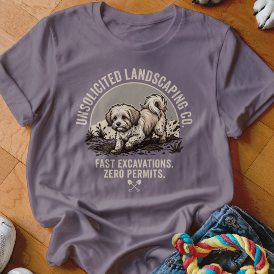 Purple t-shirt graphic featuring a dog digging with text "Unsolicited Landscaping Co." and "Fast Excavations. Zero Permits."