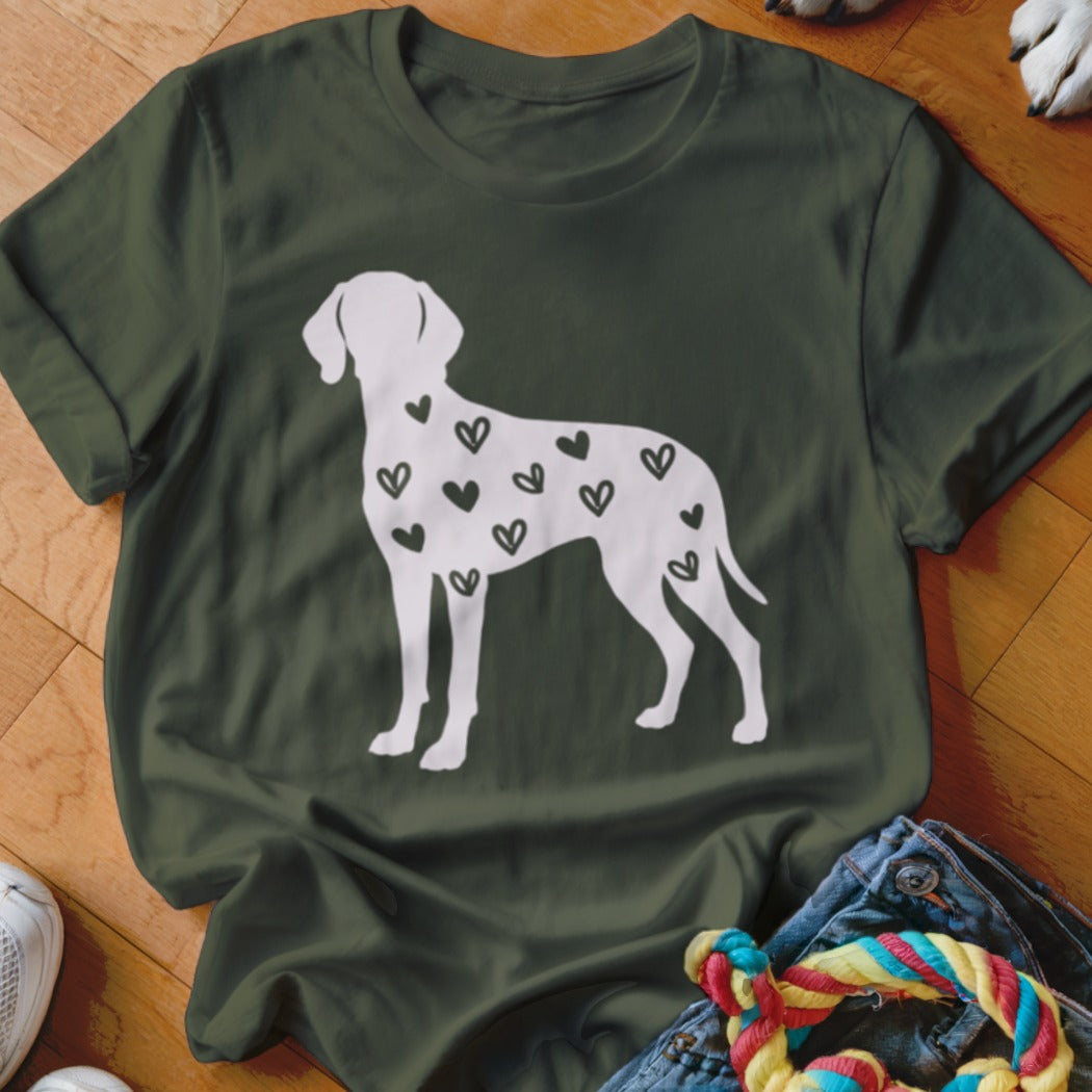White dog silhouette with black hearts on a dark green t-shirt.