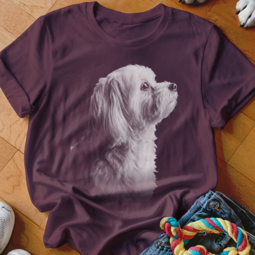 Maroon t-shirt with white dog graphic, viewed from side profile.