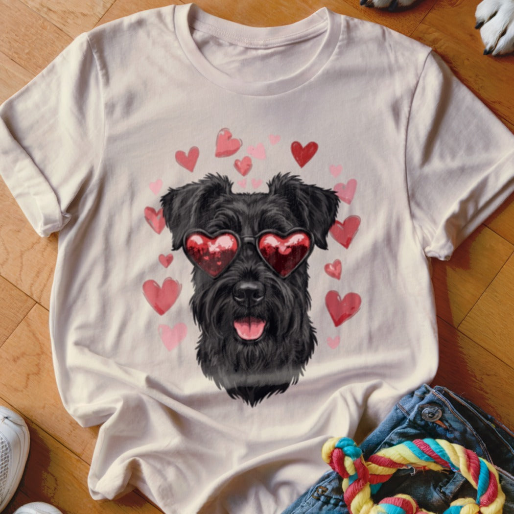 Beige t-shirt featuring a graphic of a black schnauzer wearing heart-shaped sunglasses, surrounded by pink and red hearts.
