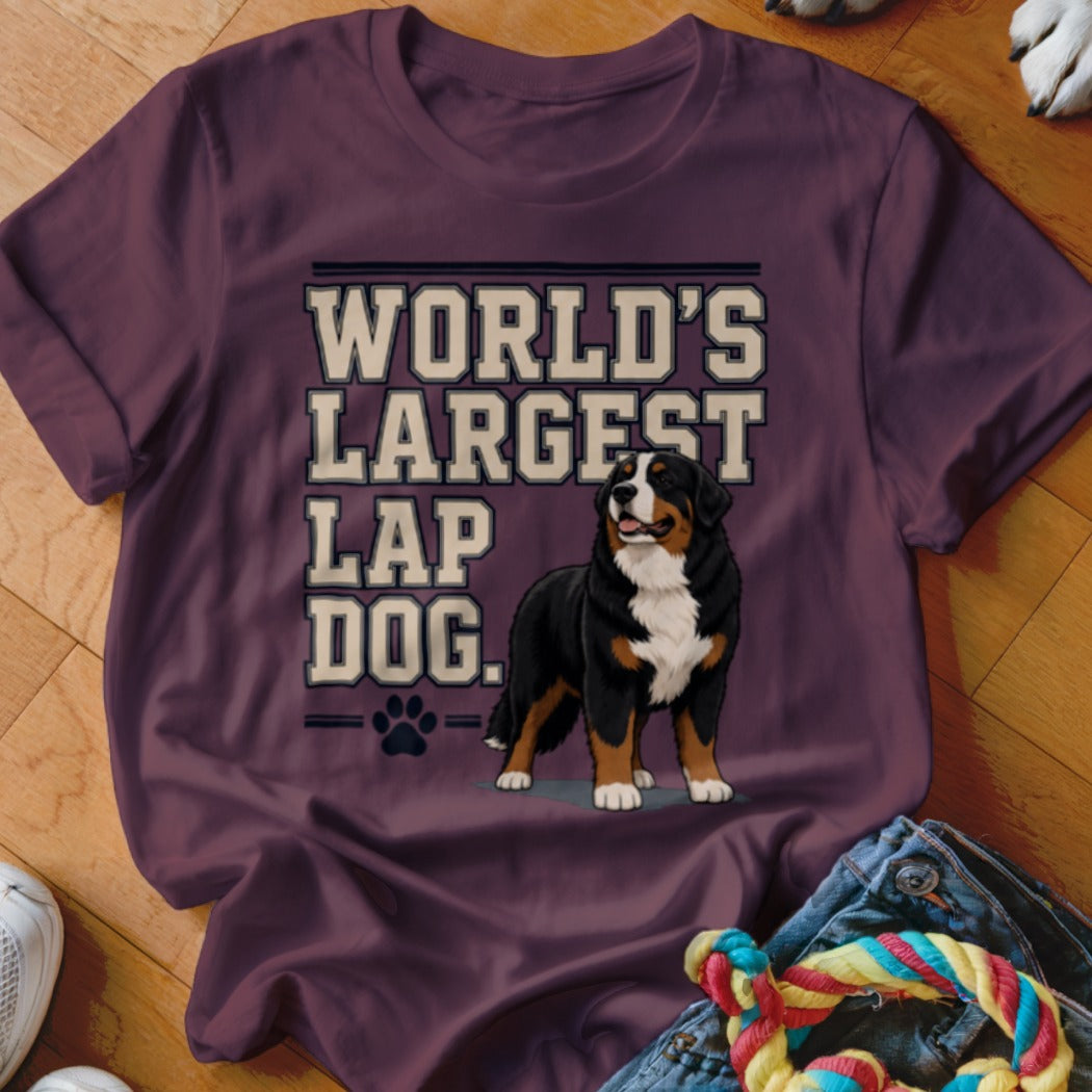 Bernese Mountain Dog with "World's Largest Lap Dog" text on a maroon t-shirt.