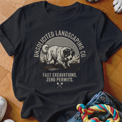 Dark t-shirt with a dog graphic and text "Unsolicited Landscaping Co. Fast Excavations. Zero Permits."