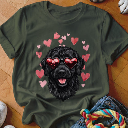 Dark green t-shirt featuring a graphic of a black poodle wearing heart-shaped sunglasses surrounded by floating pink hearts.