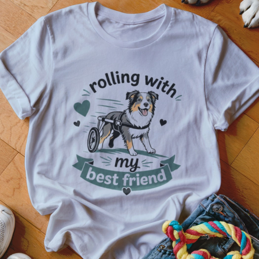 T-shirt with a cheerful dog in a wheelchair and text "rolling with my best friend."