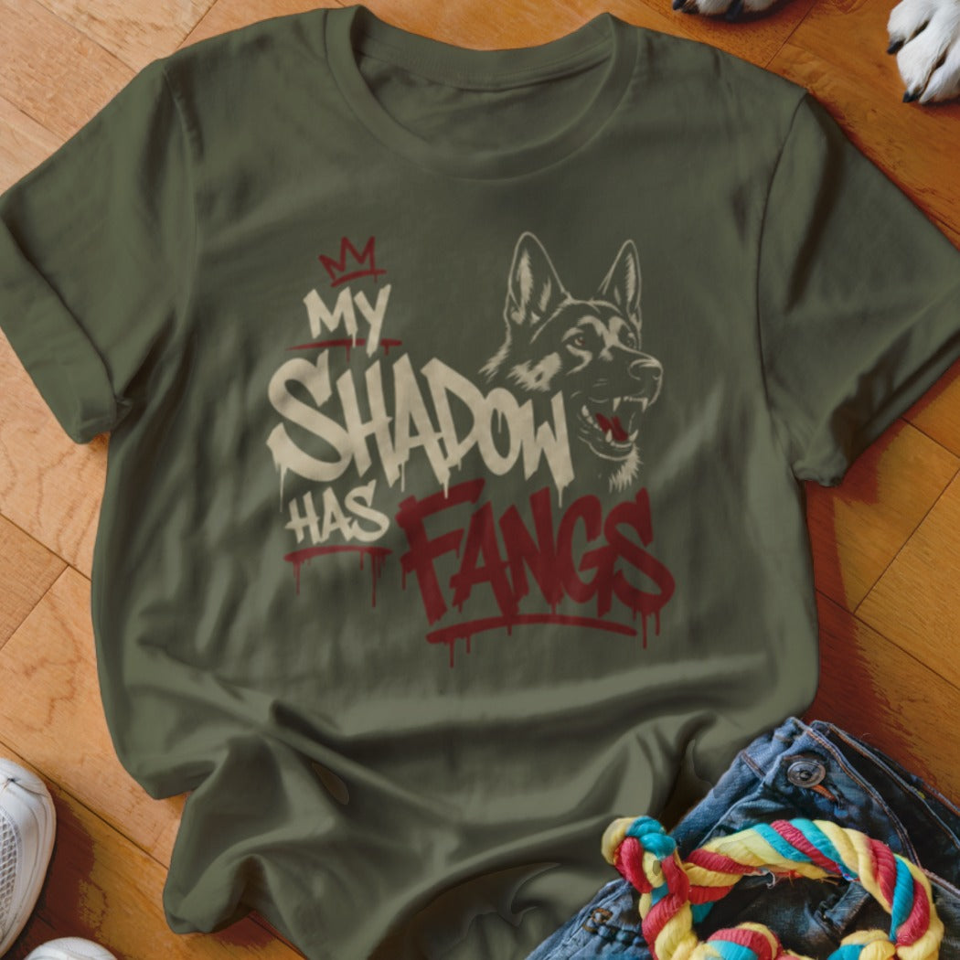 Olive t-shirt with a German Shepherd graphic and text "MY SHADOW HAS FANGS".