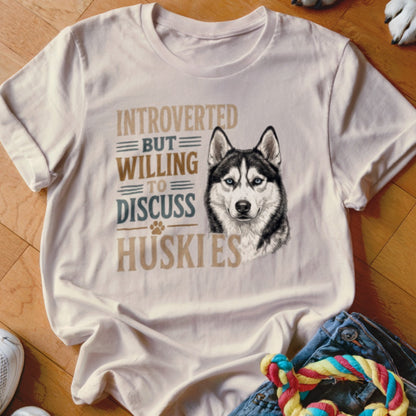 White t-shirt with a husky illustration and text that reads "INTROVERTED BUT WILLING TO DISCUSS HUSKIES".