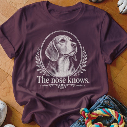 Burgundy t-shirt with Beagle portrait in a laurel wreath and text "The nose knows."