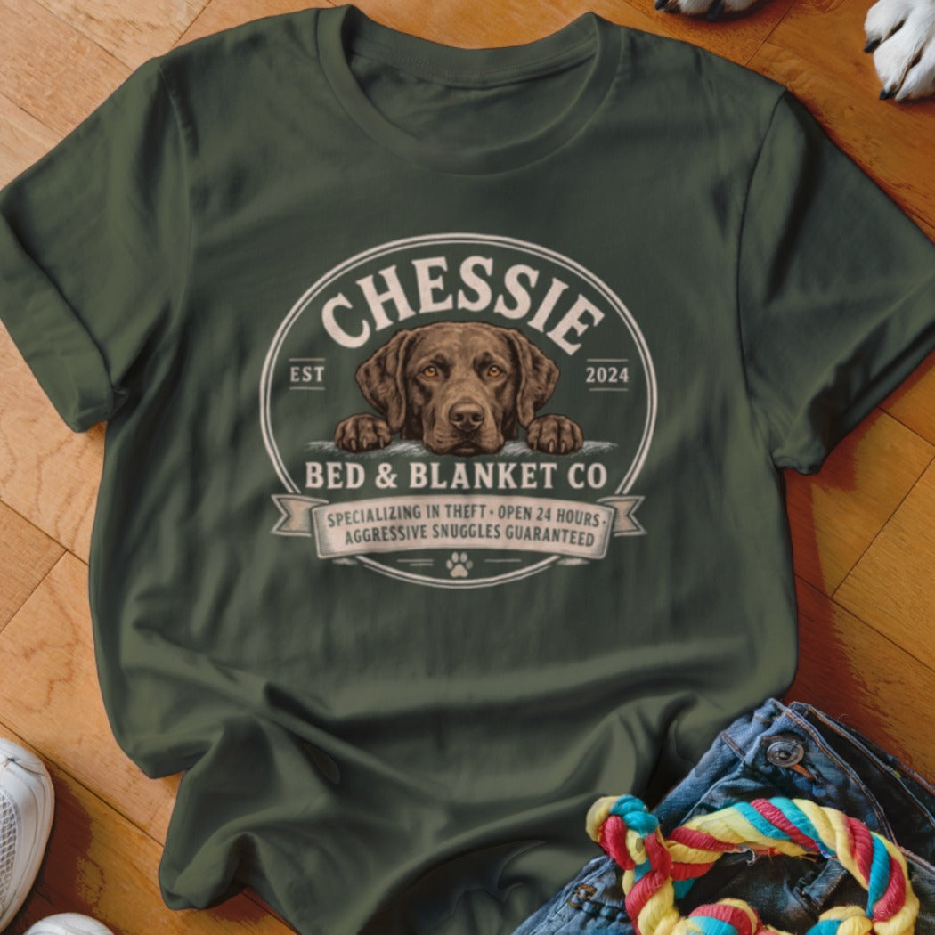 Green t-shirt with Chessie Bed & Blanket Co. logo featuring a brown dog.