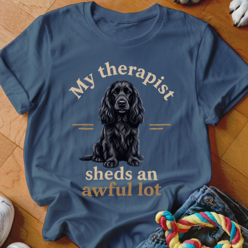 Blue t-shirt with black cocker spaniel graphic and text "My therapist sheds an awful lot".