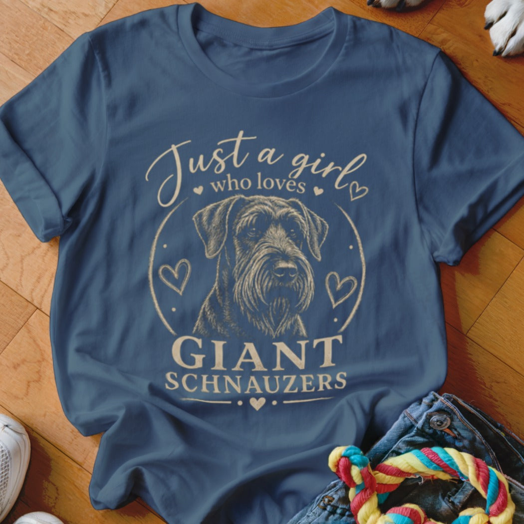 A blue t-shirt printed with a Giant Schnauzer graphic and the text Just a girl who loves Giant Schnauzers.