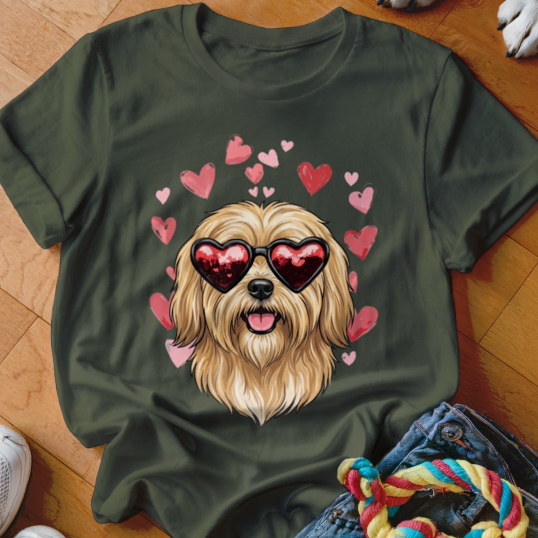 Dark green t-shirt featuring a graphic of a shaggy blonde dog wearing heart-shaped sunglasses surrounded by pink hearts.