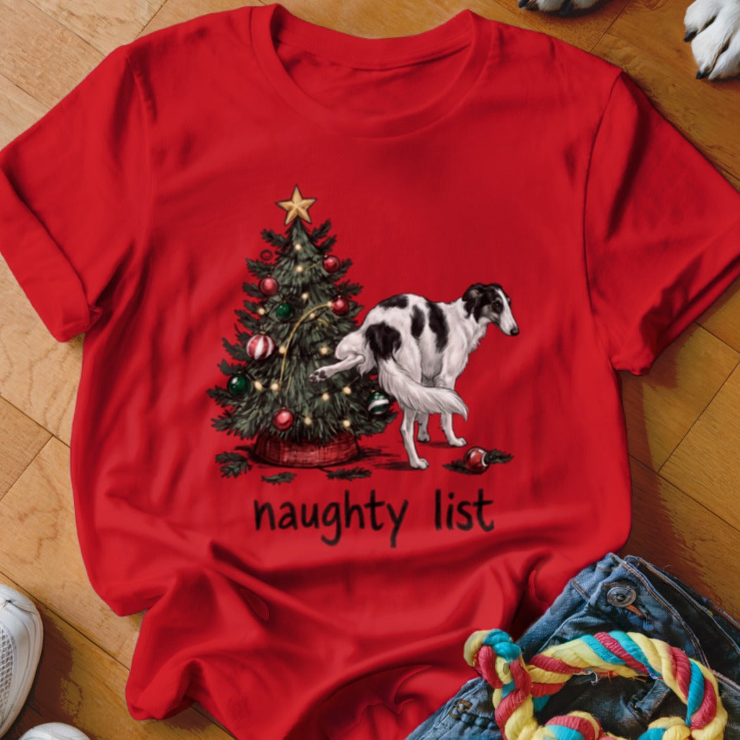 Red t-shirt featuring a Borzoi dog urinating on a Christmas tree with the text naughty list.
