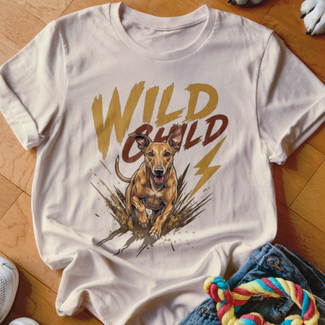 Cream t-shirt featuring a graphic of a running brown dog, mud splashes, and the text Wild Child.