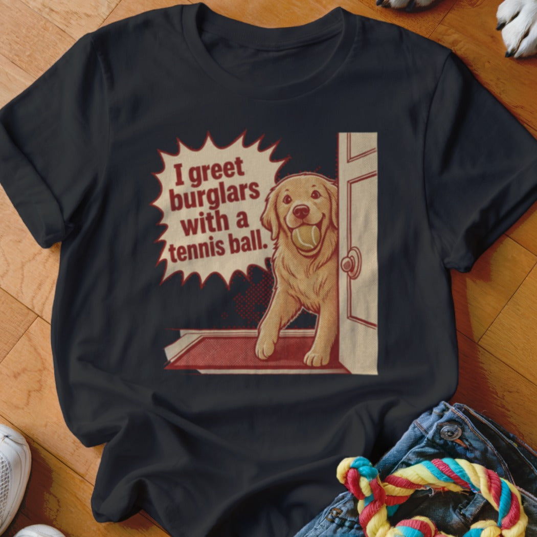 Black t-shirt with Golden Retriever holding tennis ball, text reads "I greet burglars with a tennis ball."