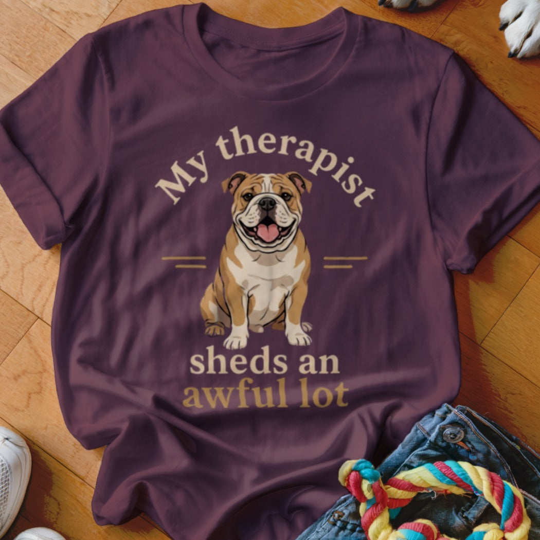 Burgundy t-shirt with bulldog graphic and text "My therapist sheds an awful lot."