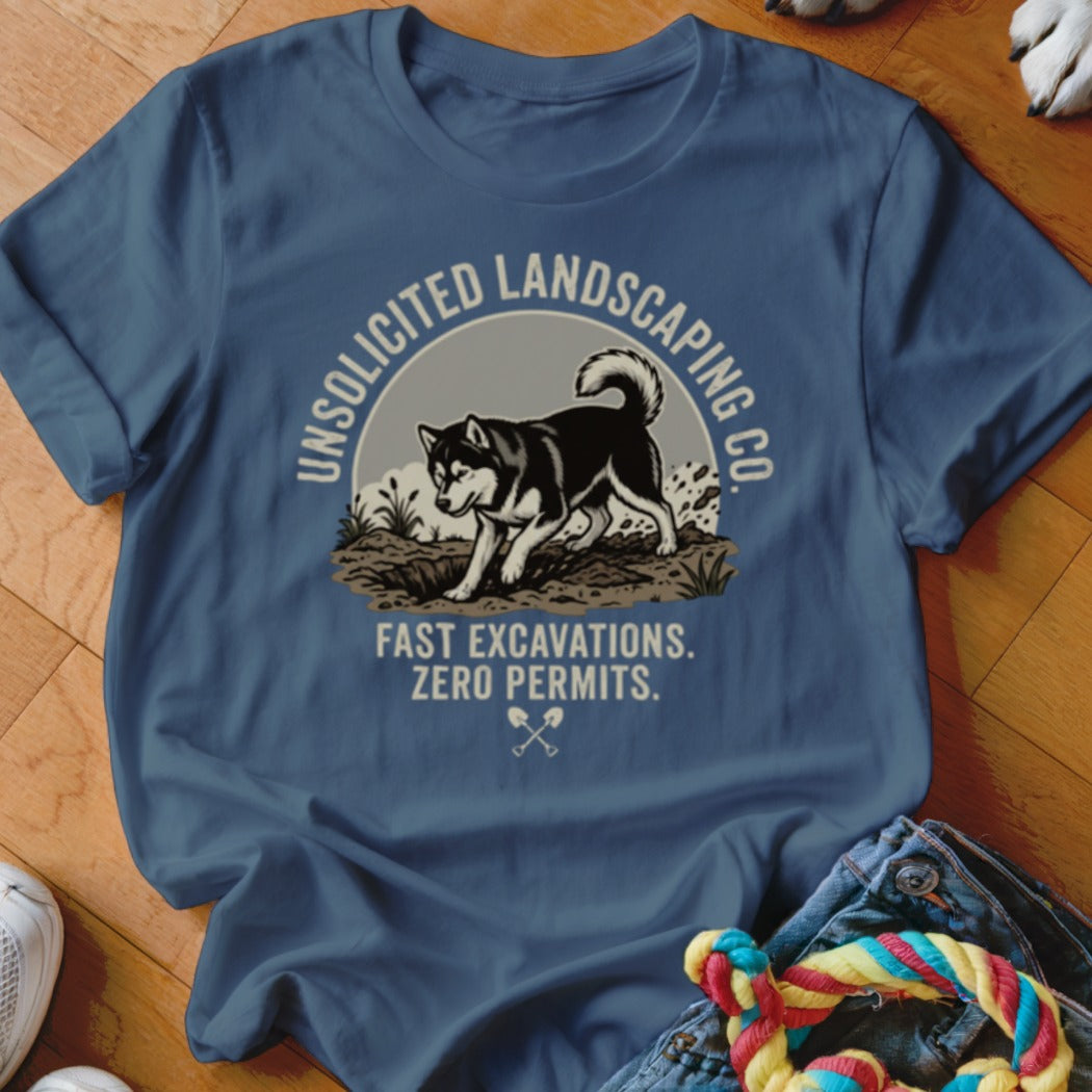Blue t-shirt with graphic of husky digging dirt, text "UNSOLICITED LANDSCAPING CO."