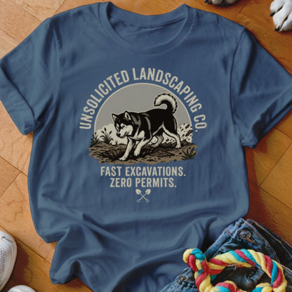 Blue t-shirt with graphic of husky digging dirt, text "UNSOLICITED LANDSCAPING CO."