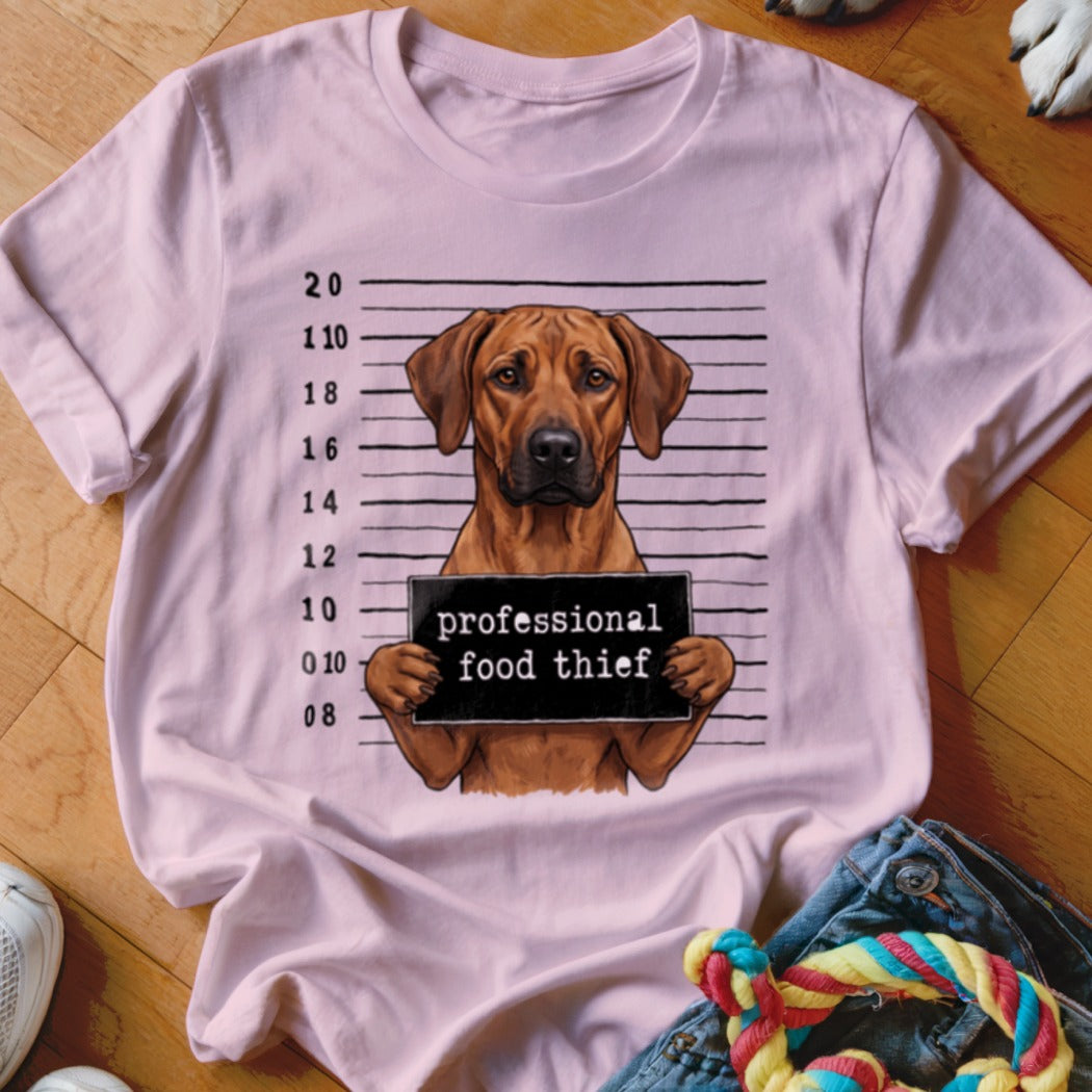 Rhodesian Ridgeback dog mugshot with "professional food thief" text.