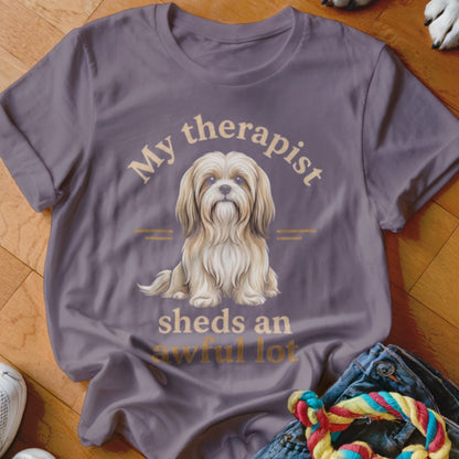 T-shirt with a fluffy dog illustration and text "My therapist sheds an awful lot".