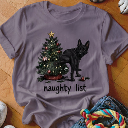 Black German Shepherd near Christmas tree with text "naughty list"