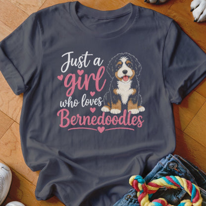 Dark grey t-shirt with a Bernedoodle dog illustration and the text "Just a girl who loves Bernedoodles".
