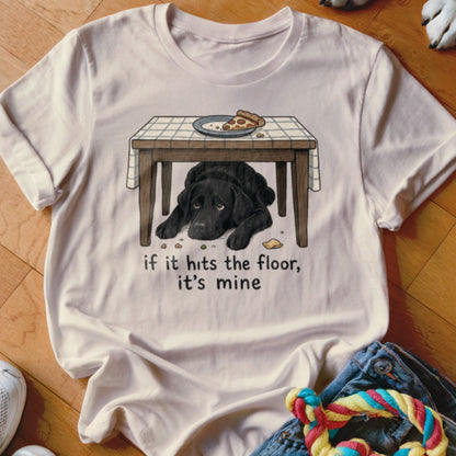 Black lab under table with pizza and text "if it hits the floor, it's mine".