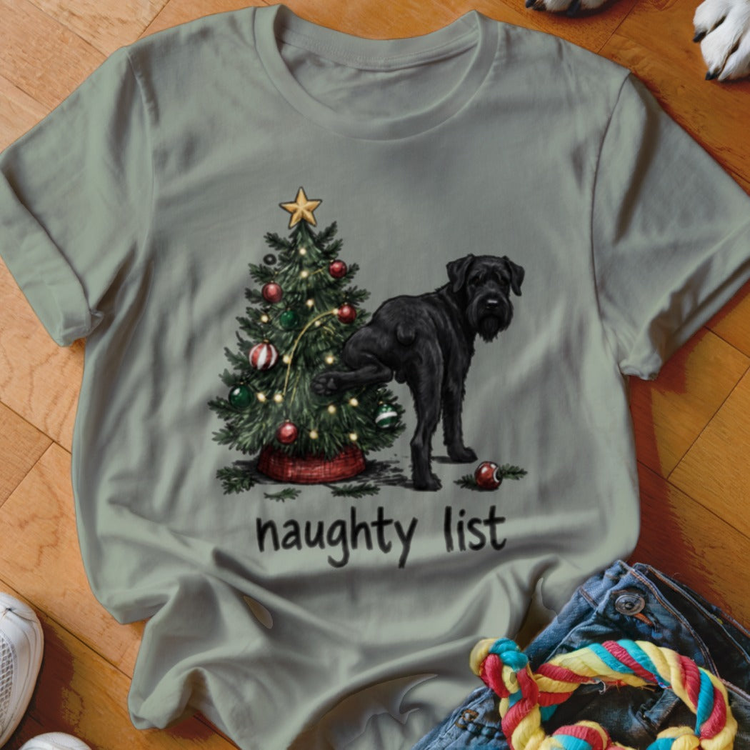 Black dog lifting leg on Christmas tree with "naughty list" text.