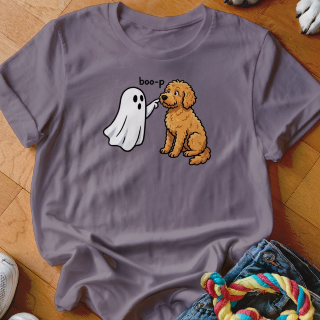 Ghost character booping a golden doodle dog on a purple t-shirt.