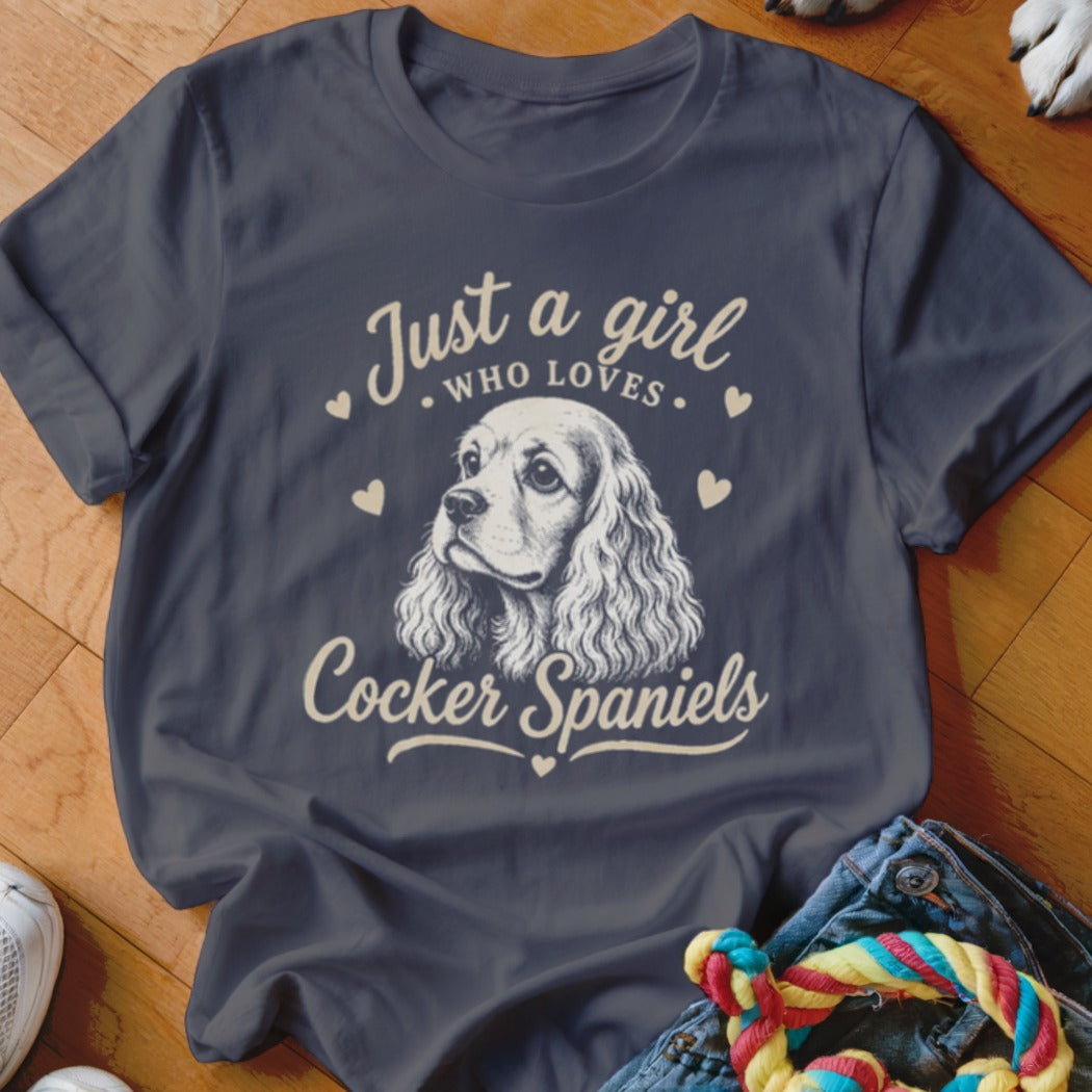 Dark blue t-shirt with "Just a girl who loves Cocker Spaniels" text and dog graphic.
