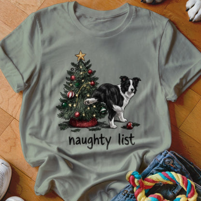 Border collie next to a Christmas tree with "naughty list" text.