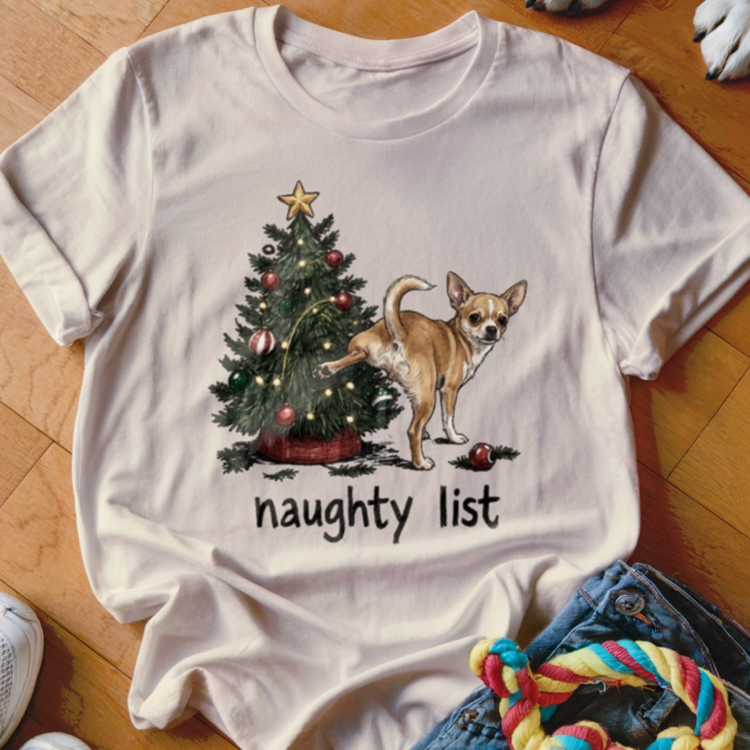 Chihuahua pees on Christmas tree with text "naughty list".