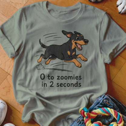 Gray t-shirt with a cartoon dog running and text "0 to zoomies in 2 seconds".