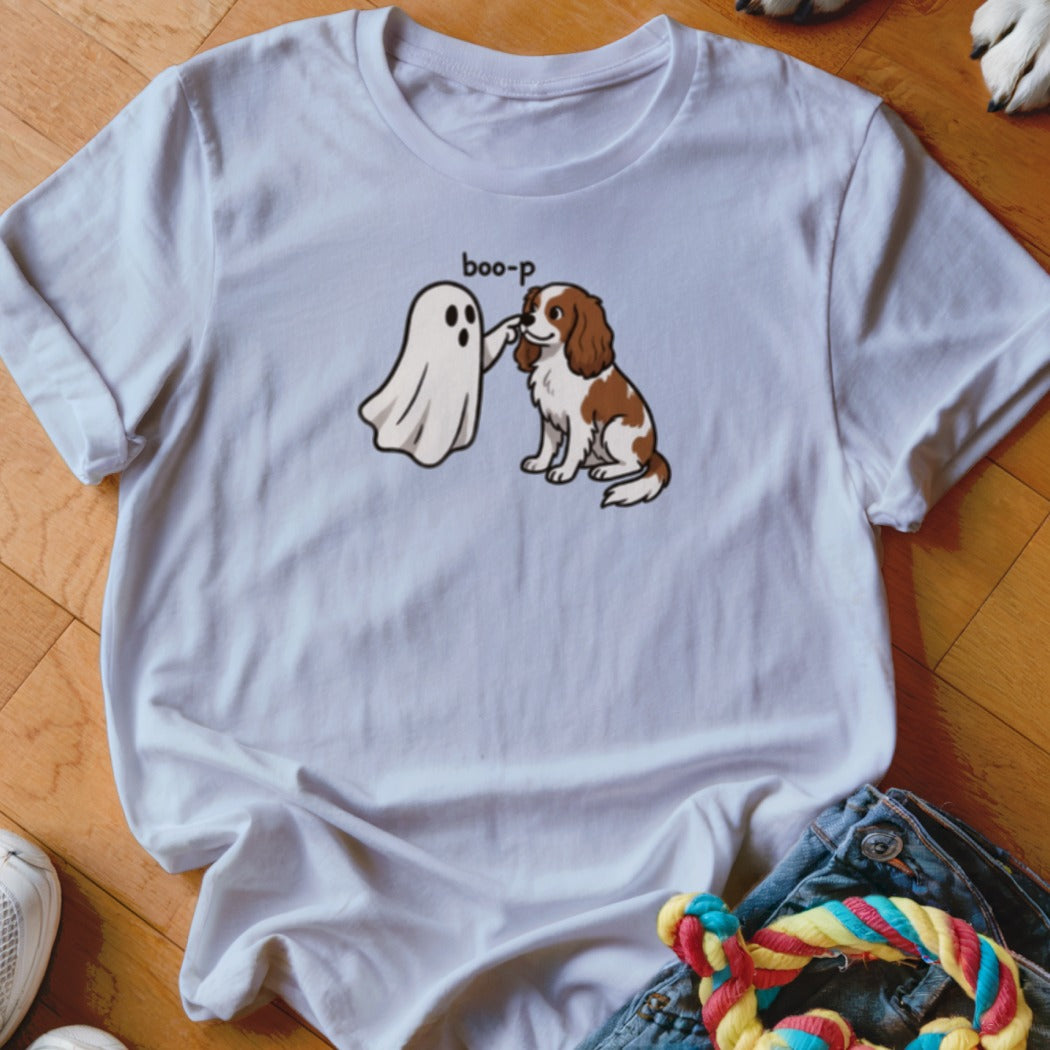 White t-shirt with cartoon ghost booping a brown and white dog, with text "boo-p".