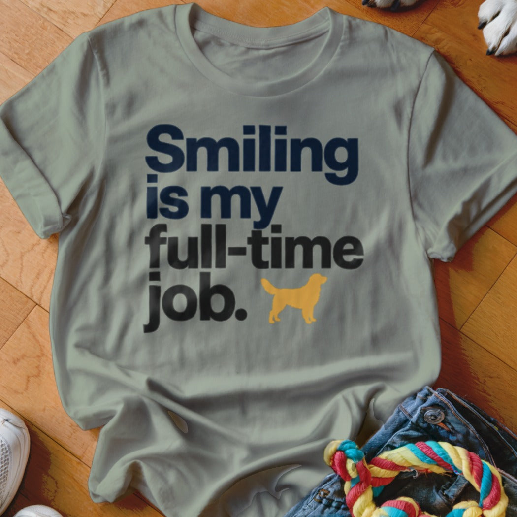 Gray t-shirt with text "Smiling is my full-time job." and golden retriever silhouette.