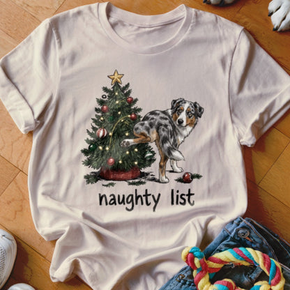 T-shirt graphic of a dog peeing on a Christmas tree with "naughty list" text.