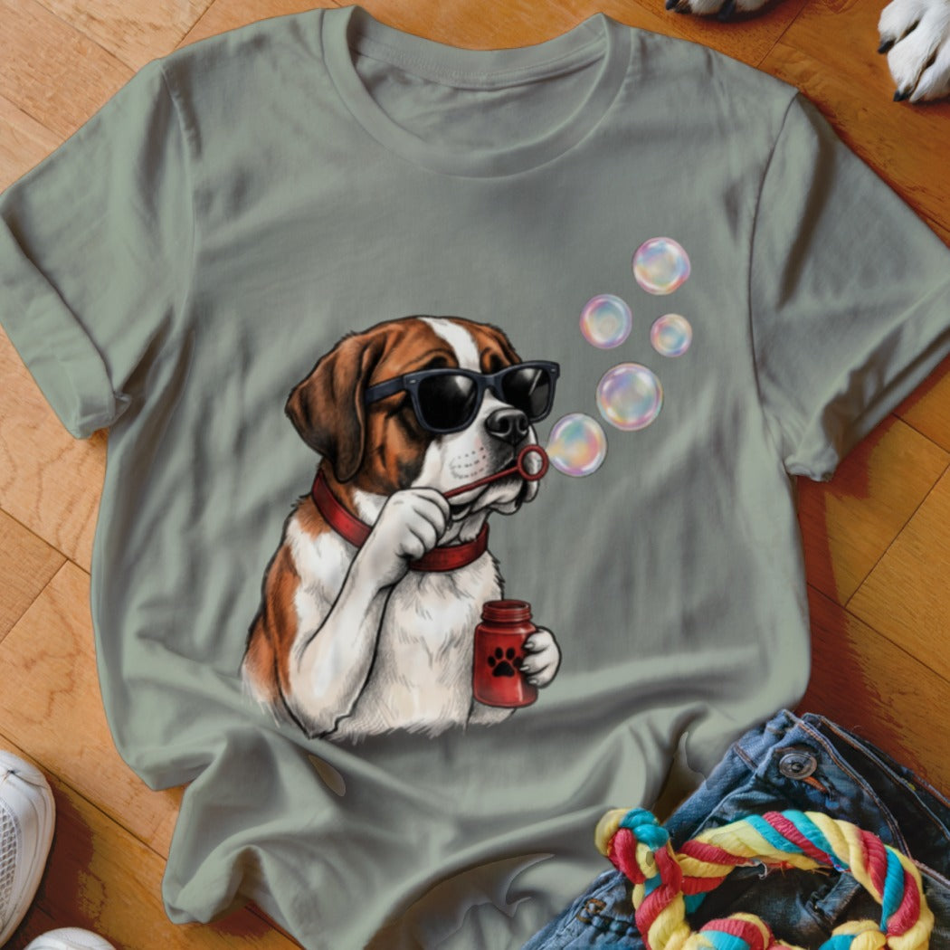 Sage green t-shirt featuring a graphic of a Saint Bernard dog wearing sunglasses and blowing bubbles.