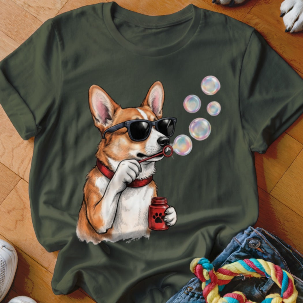 Dark green t-shirt featuring a graphic of a corgi wearing sunglasses and blowing bubbles.